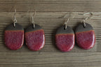 Black and red oval dangling earrings
