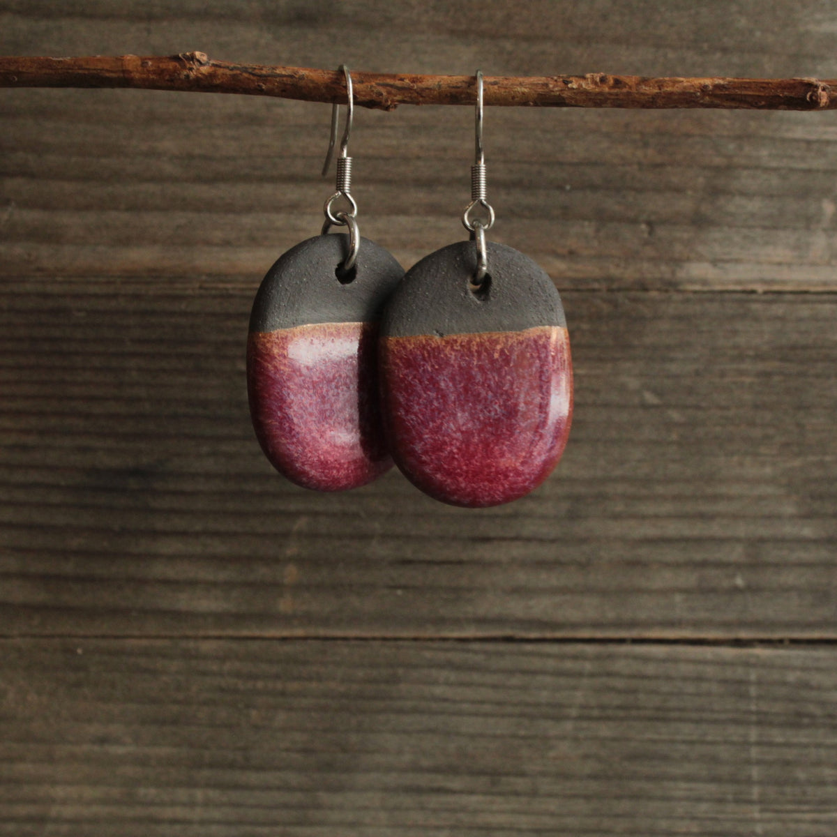 Black and red oval dangling earrings