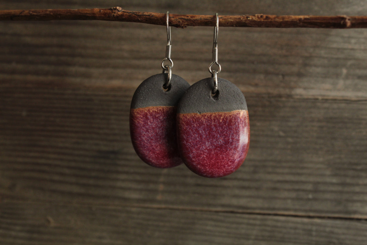 Black and red oval dangling earrings