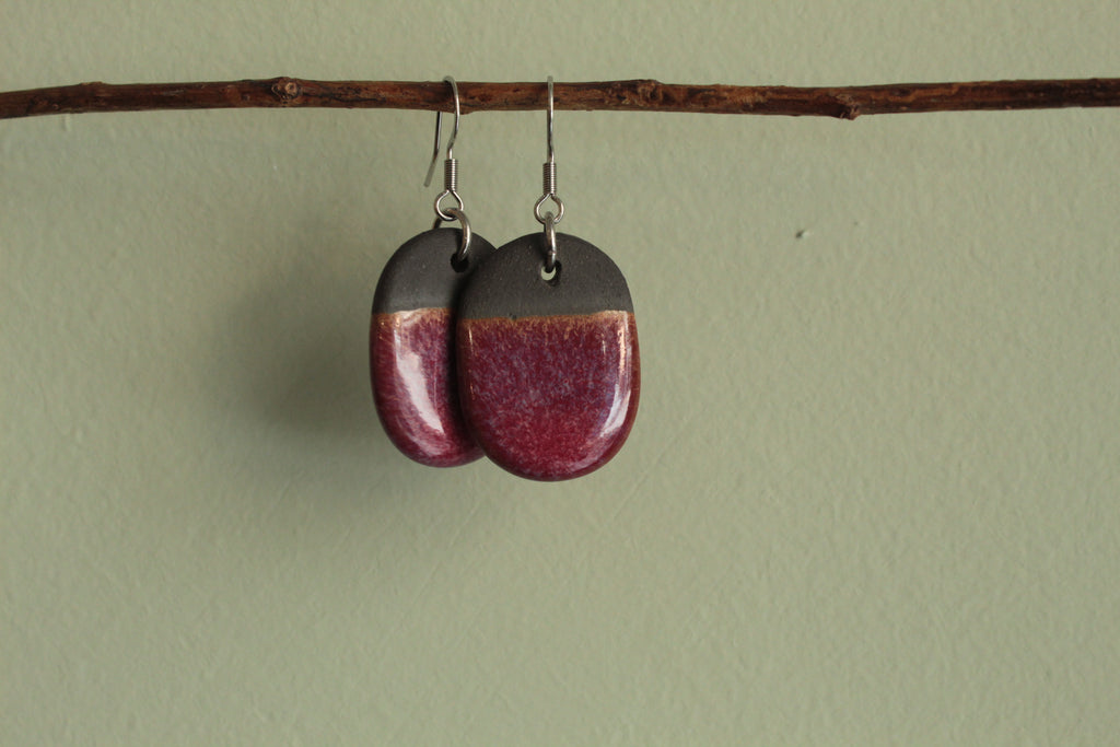 Black and red oval dangling earrings