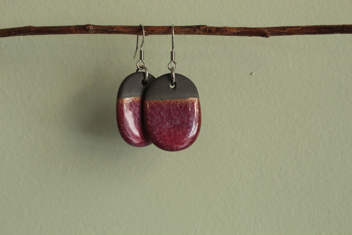Black and red oval dangling earrings