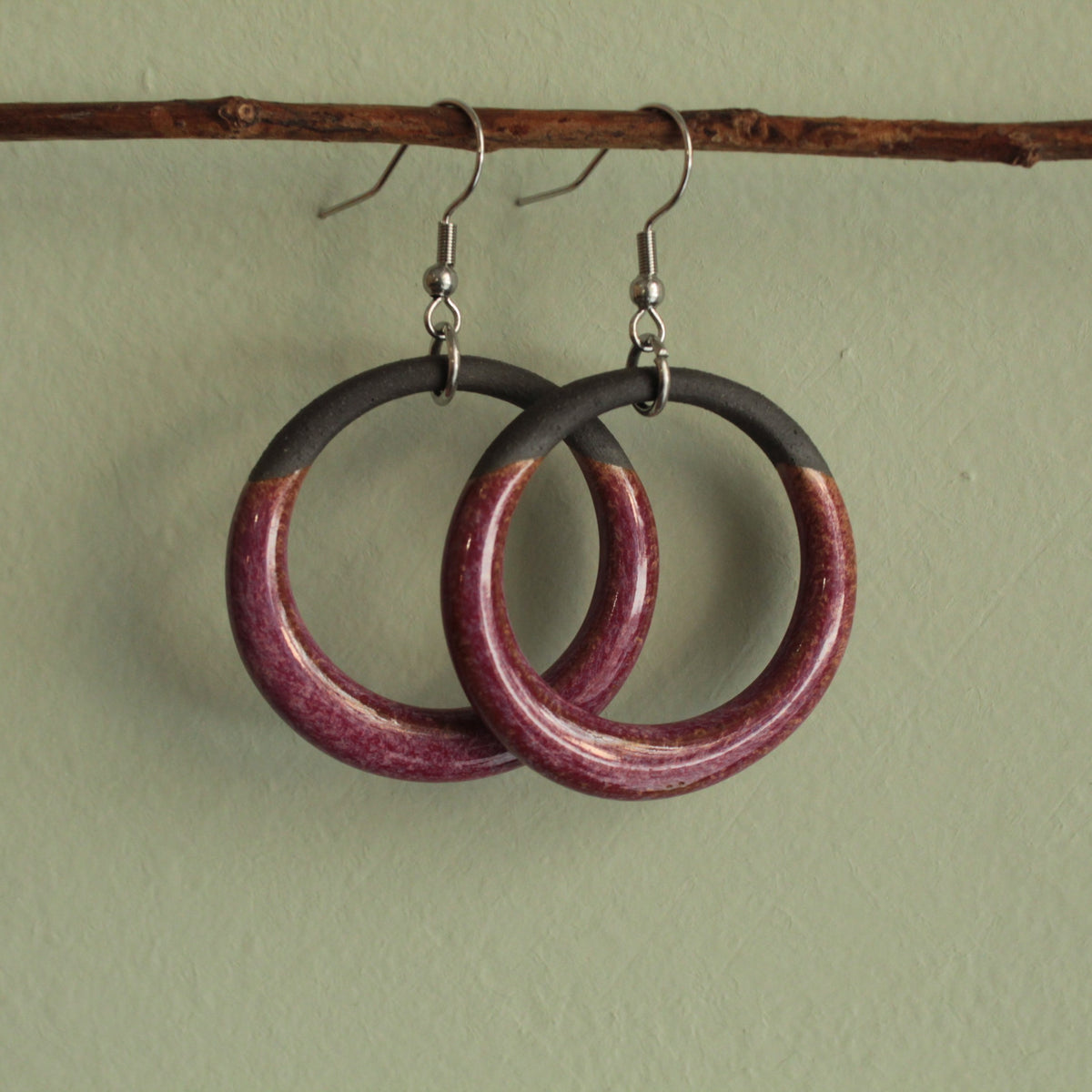Black and red hoop dangling earrings
