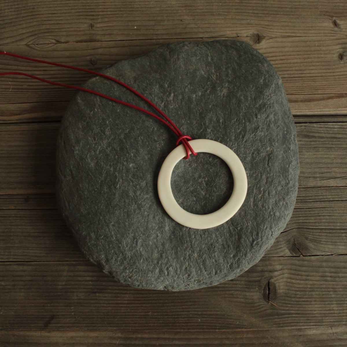 White hoop with red leather cord porcelain necklace