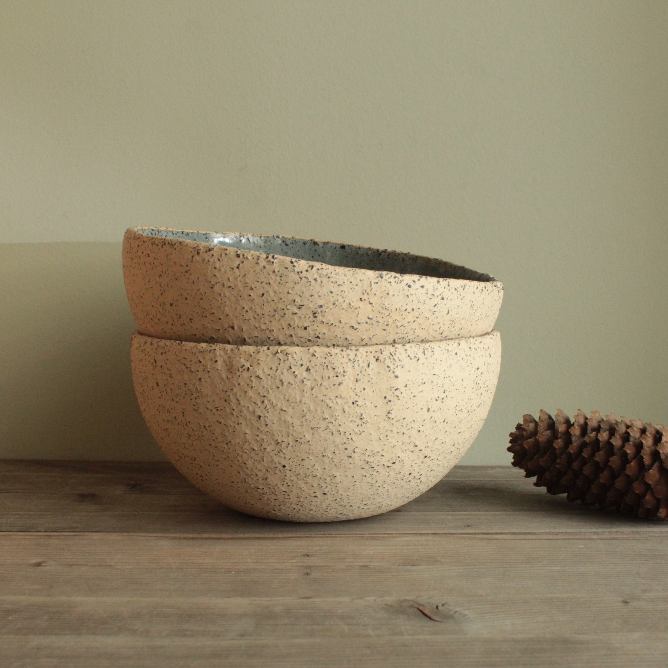 Beige bowl with ciel or green glaze