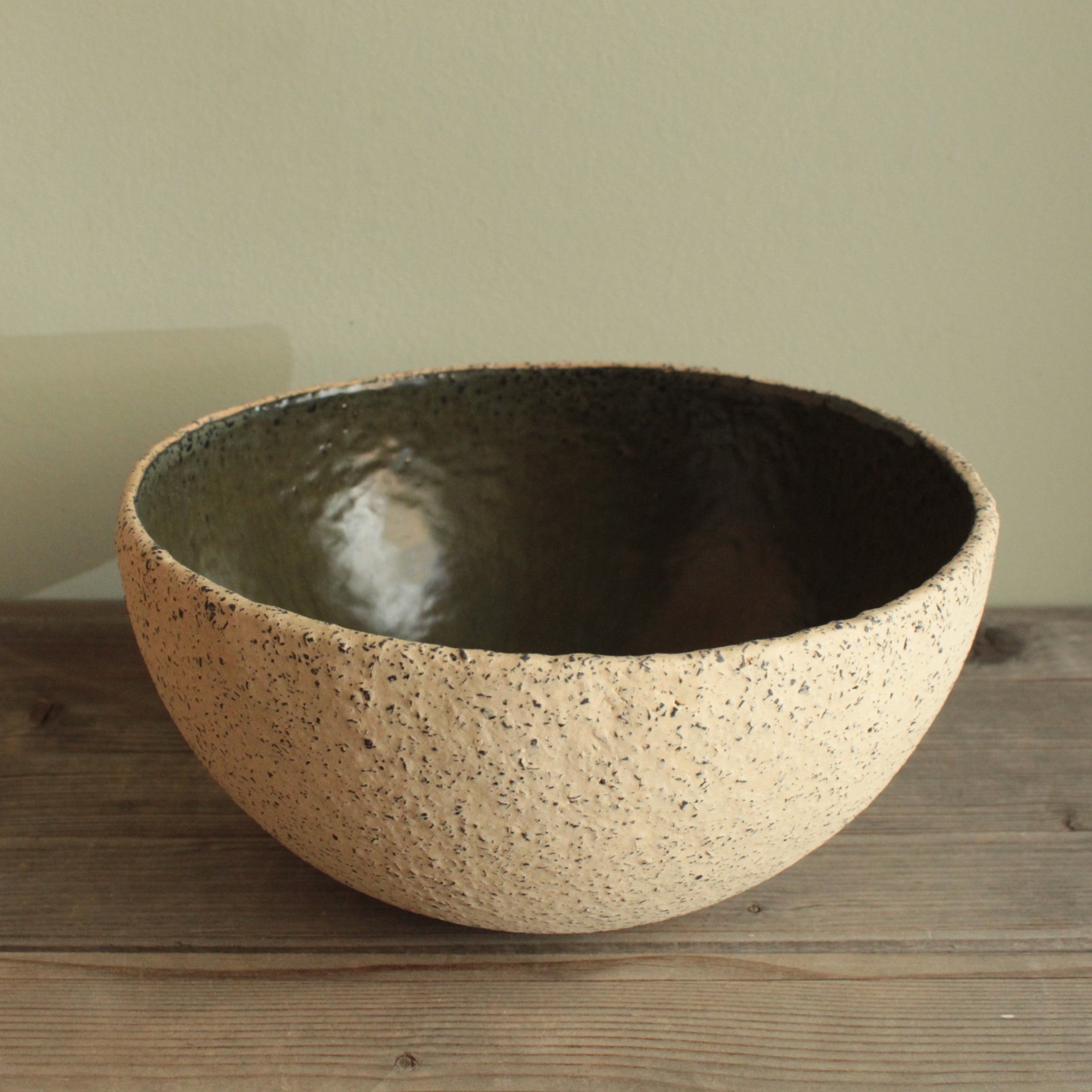 Beige bowl with ciel or green glaze