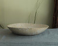 White platter/ bowl with black stones