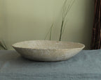 White platter/ bowl with black stones