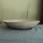 White platter/ bowl with black stones