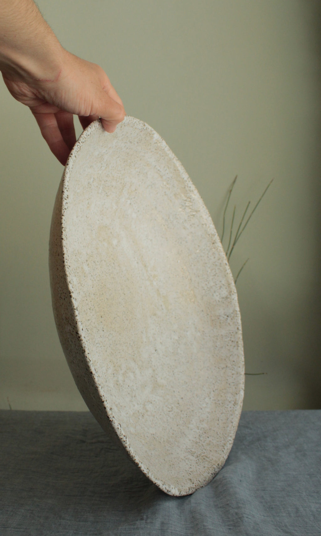 White platter/ bowl with black stones