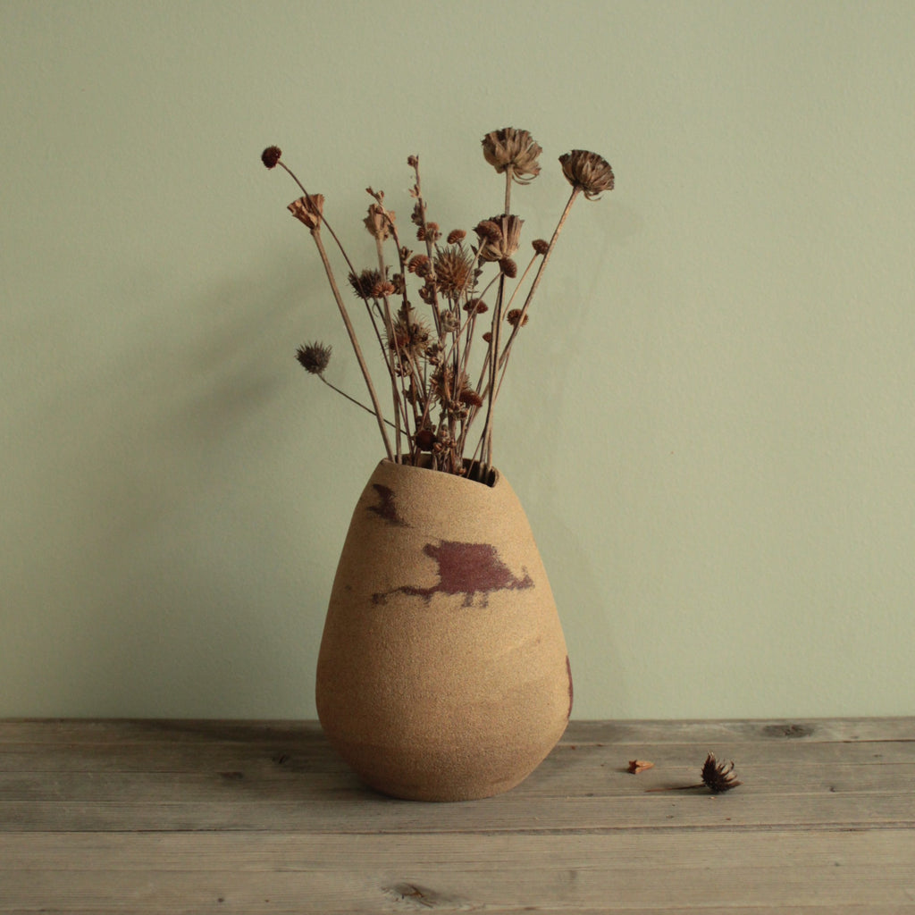 Red dino vase