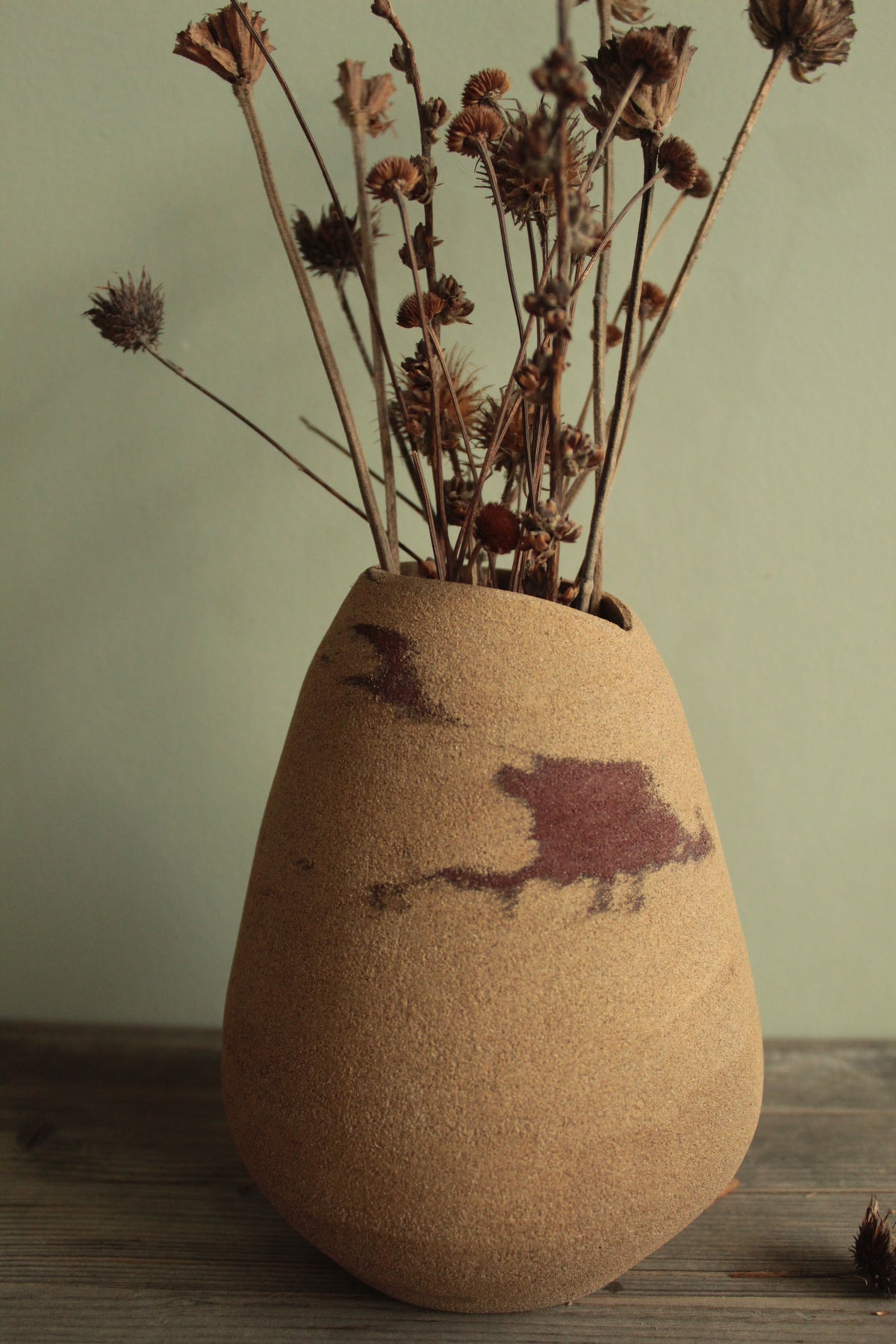 Red dino vase