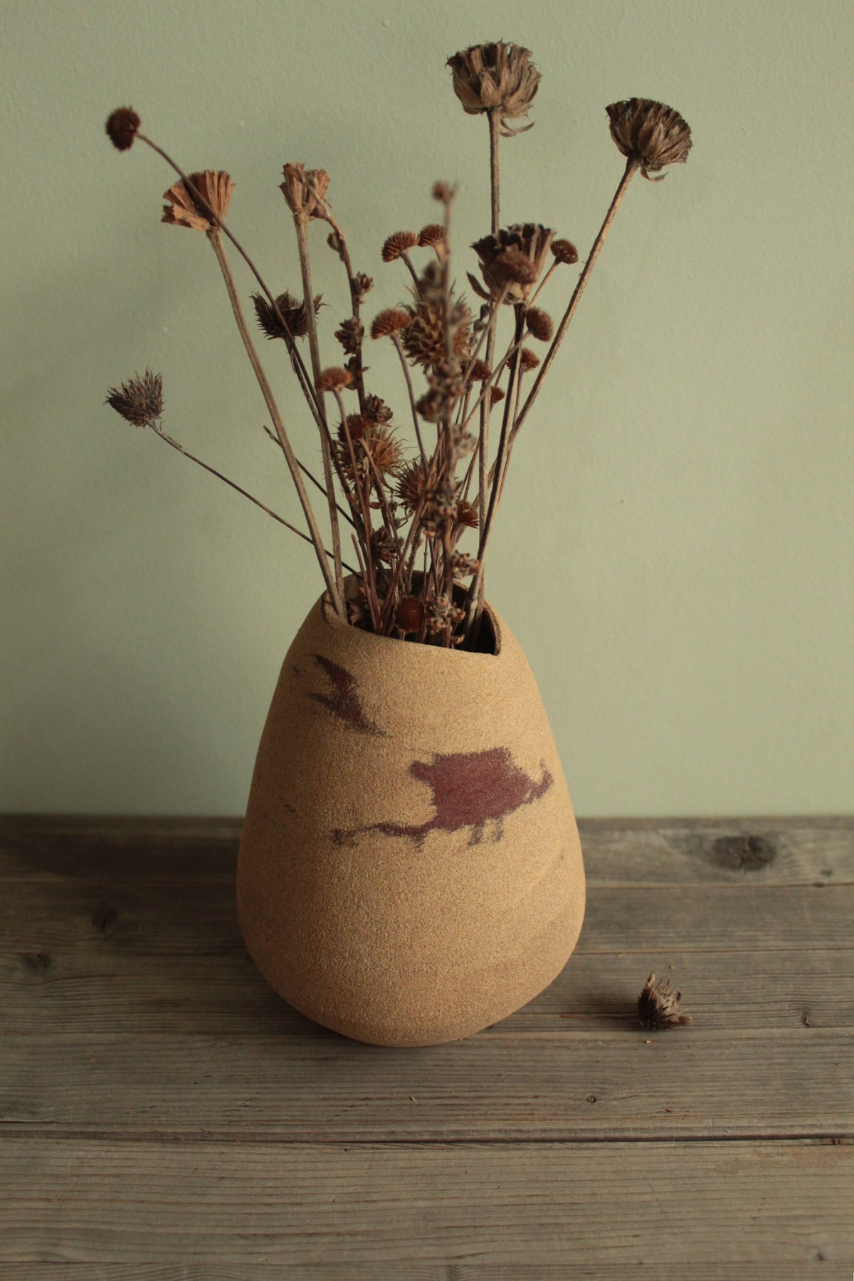 Red dino vase