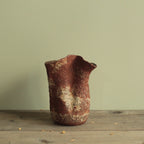 Crumbled red lava vase