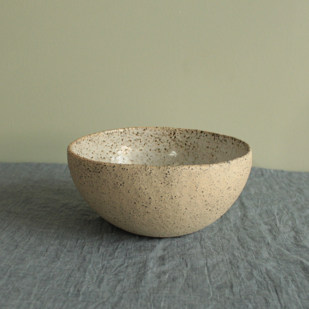 Beige bowl with silky white glaze