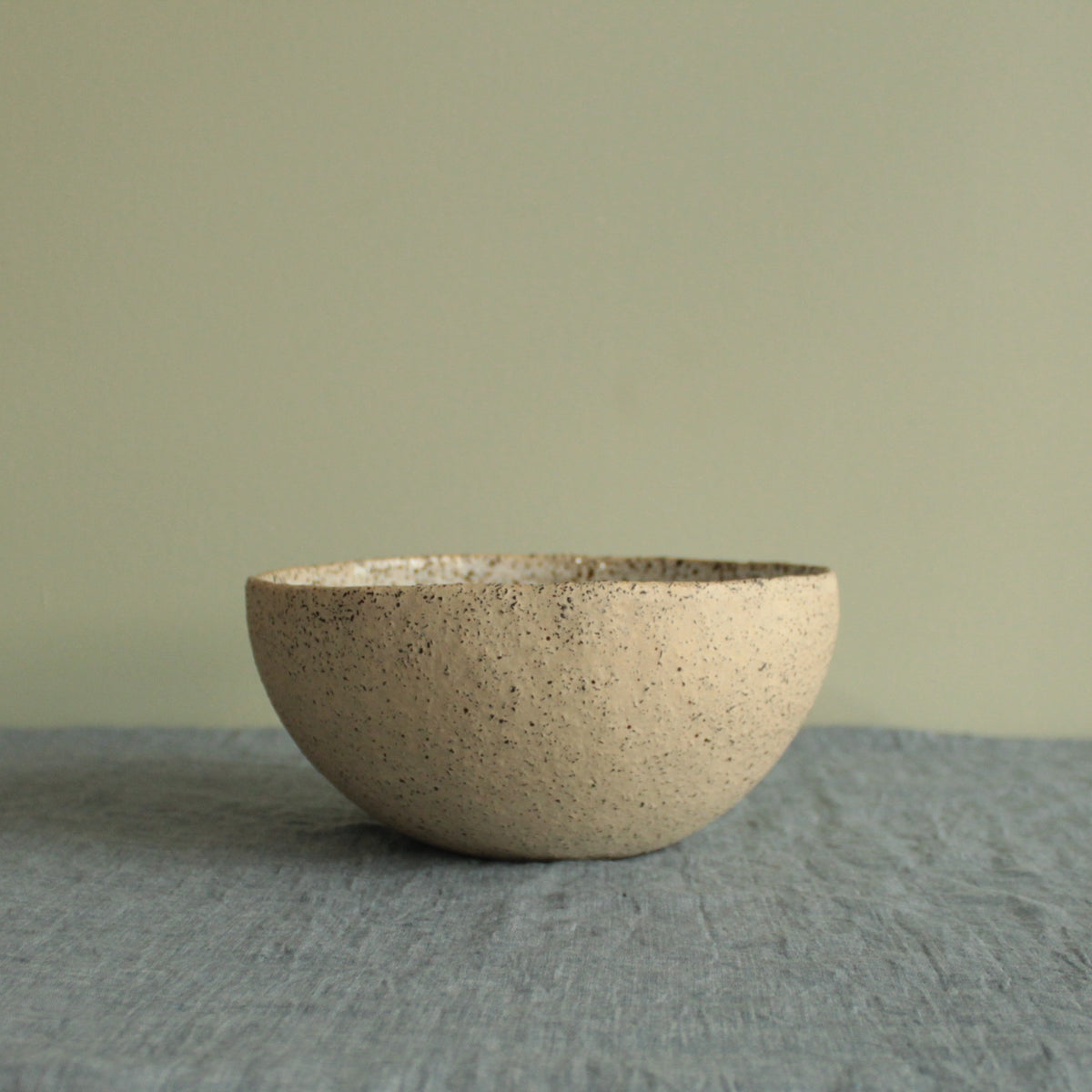 Beige bowl with silky white glaze