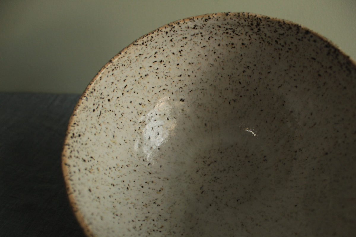 Beige bowl with silky white glaze