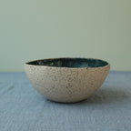 Beige bowl with botanical green glaze