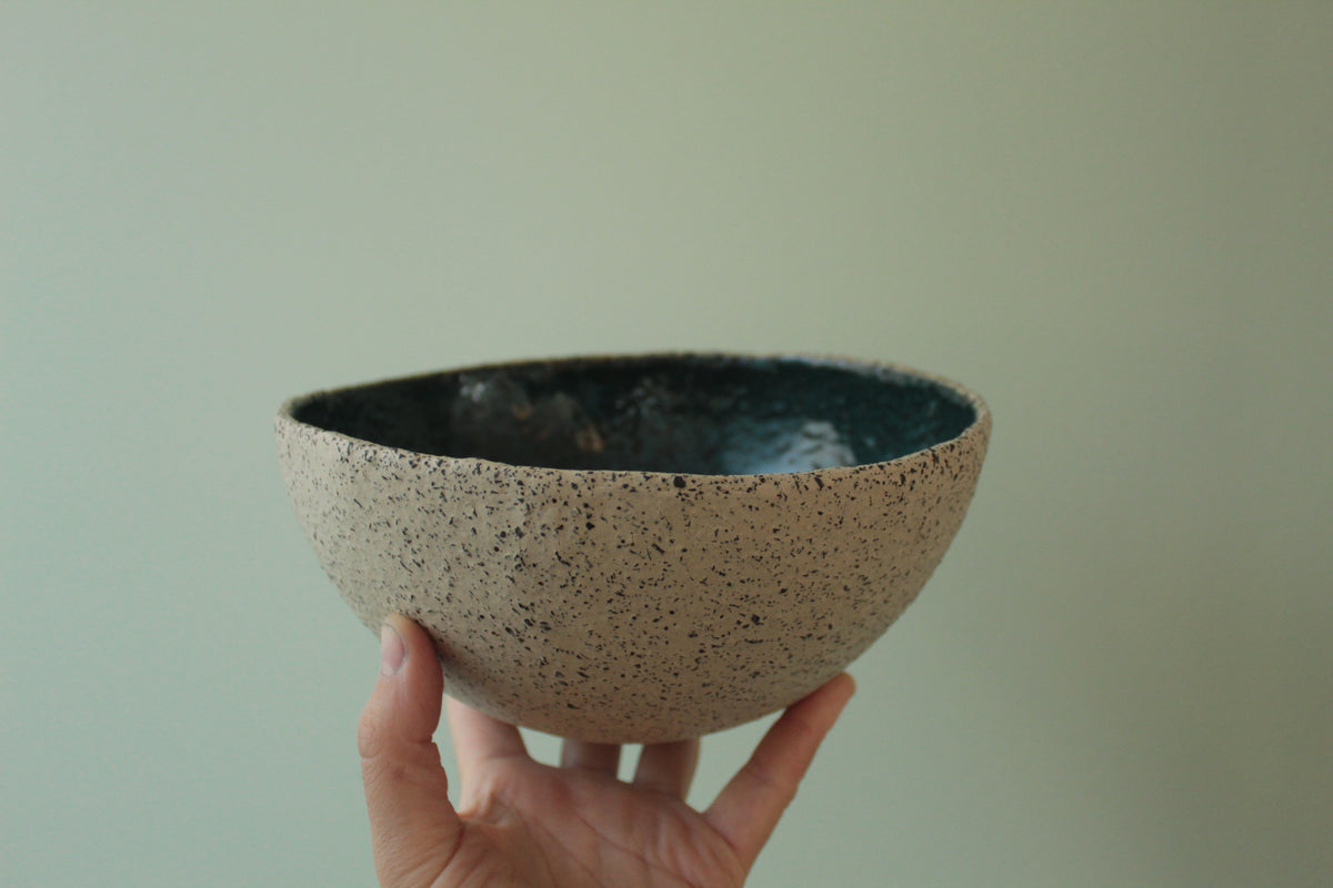 Beige bowl with botanical green glaze