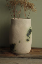 White vase with green design