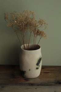 White vase with green design