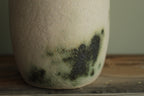 White vase with green design