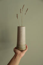 Narrow white speckled vase