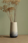 White vase with blue lines