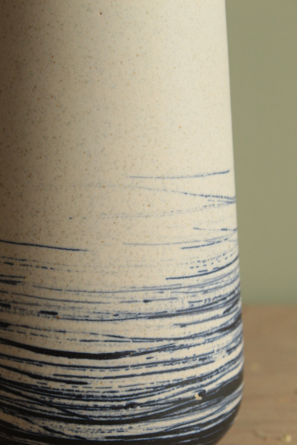 White vase with blue lines