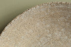 White platter/ bowl with black stones