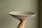 White platter/ bowl with black stones