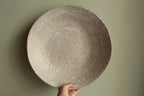 White platter/ bowl with black stones