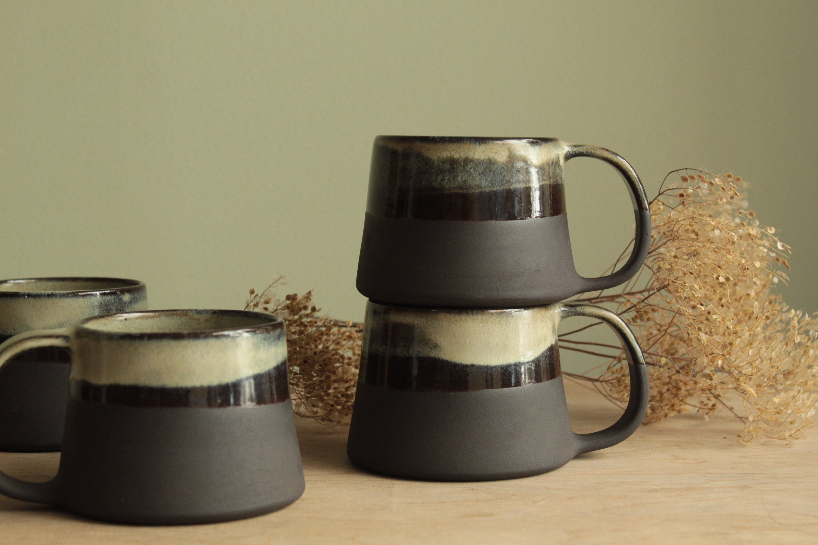 Light beige and black mug