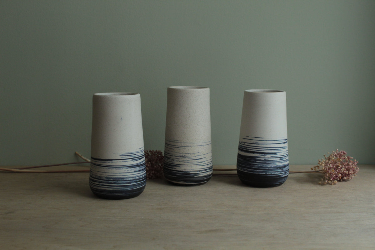 White vase with blue lines