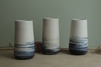 White vase with blue lines