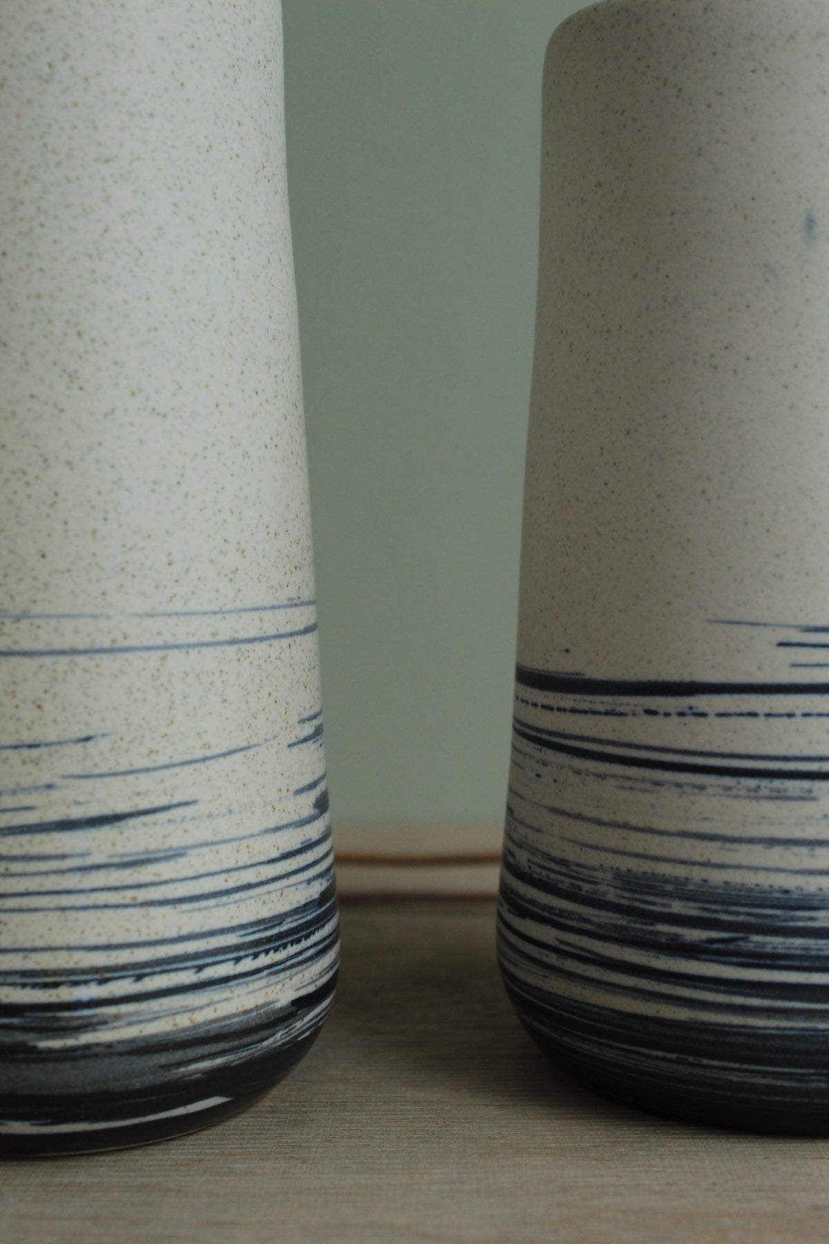 White vase with blue lines