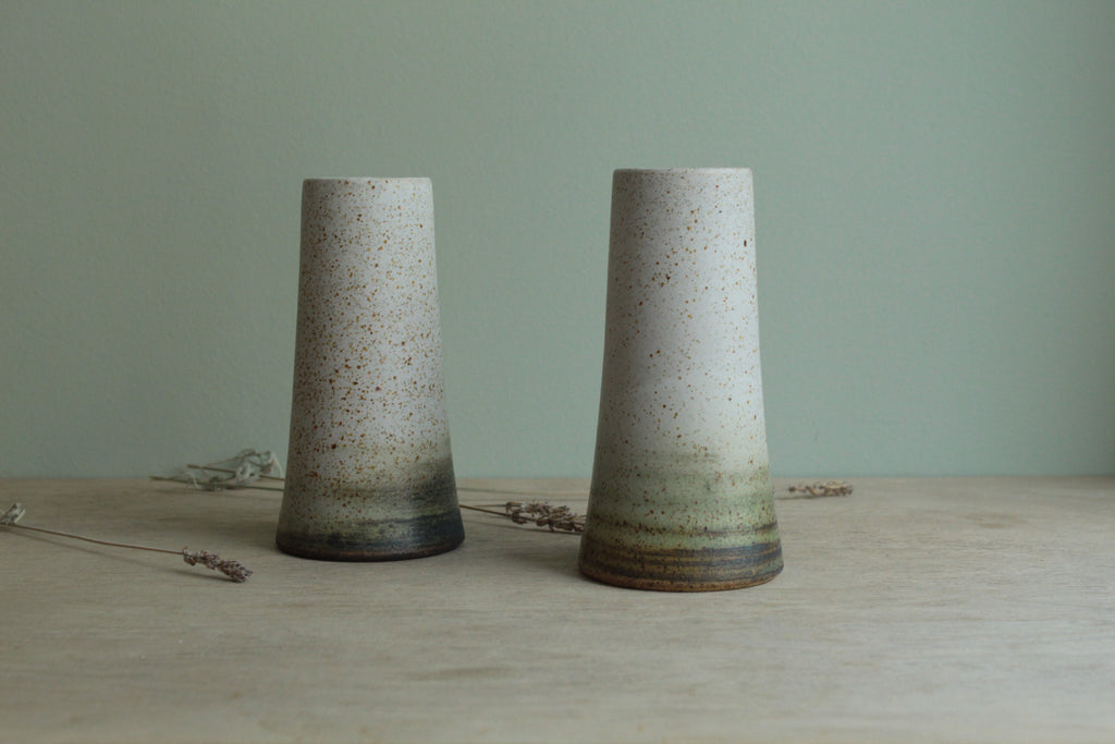 Narrow white speckled vase