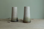 Narrow white speckled vase