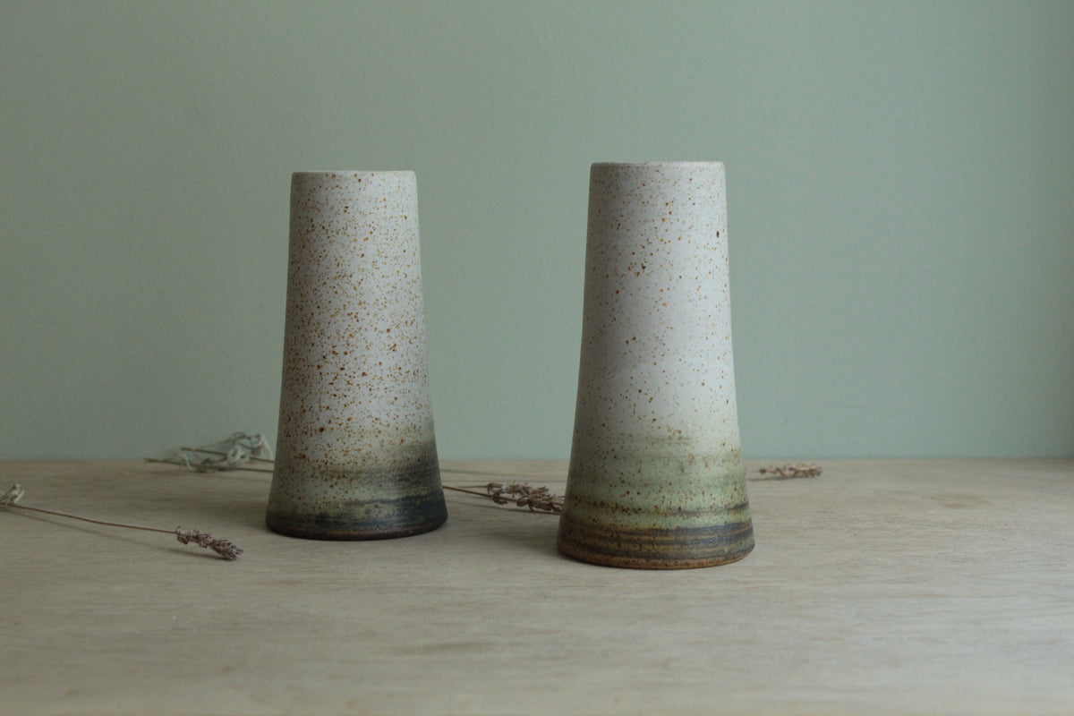 Narrow white speckled vase