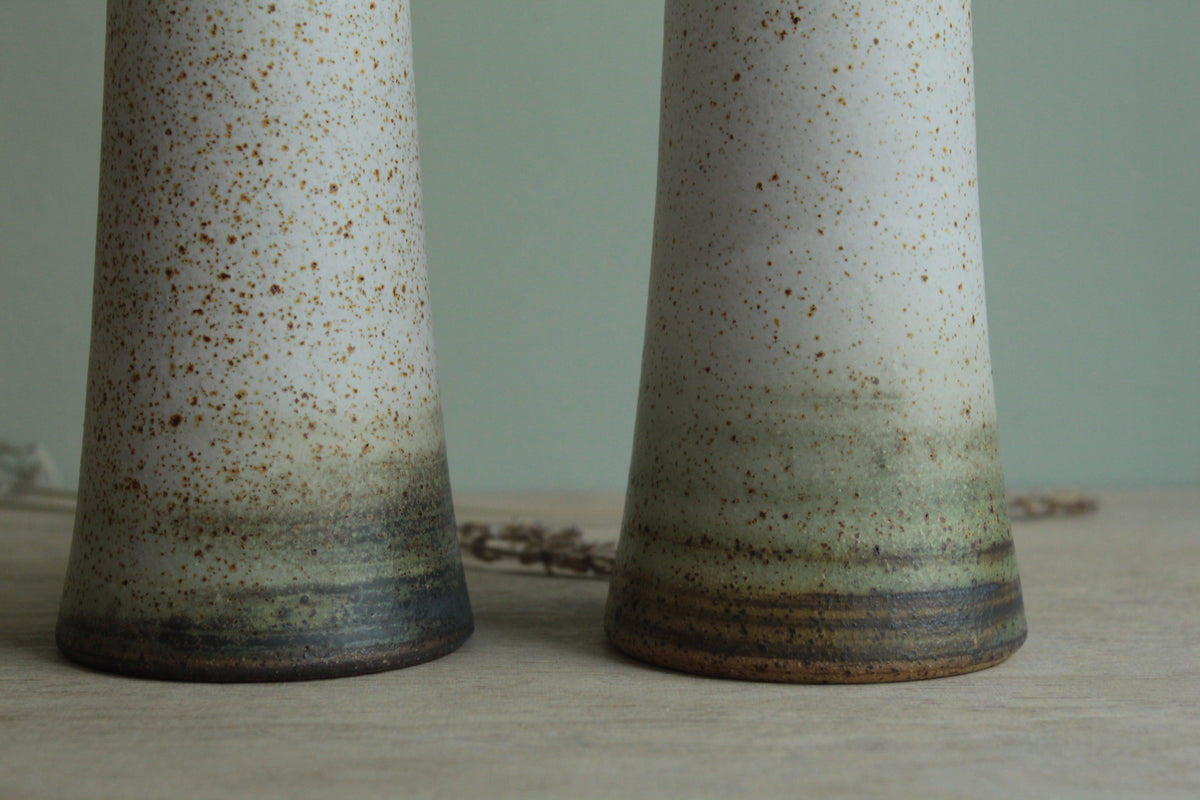 Narrow white speckled vase