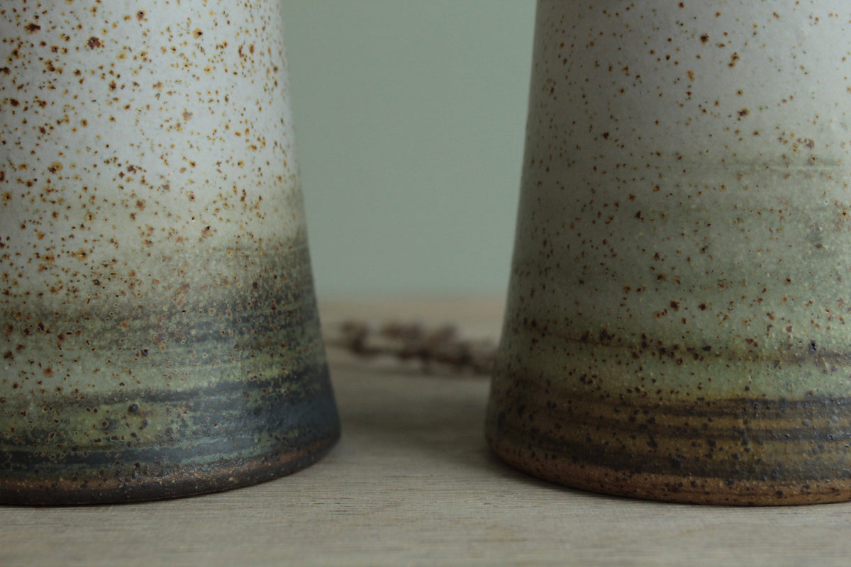 Narrow white speckled vase