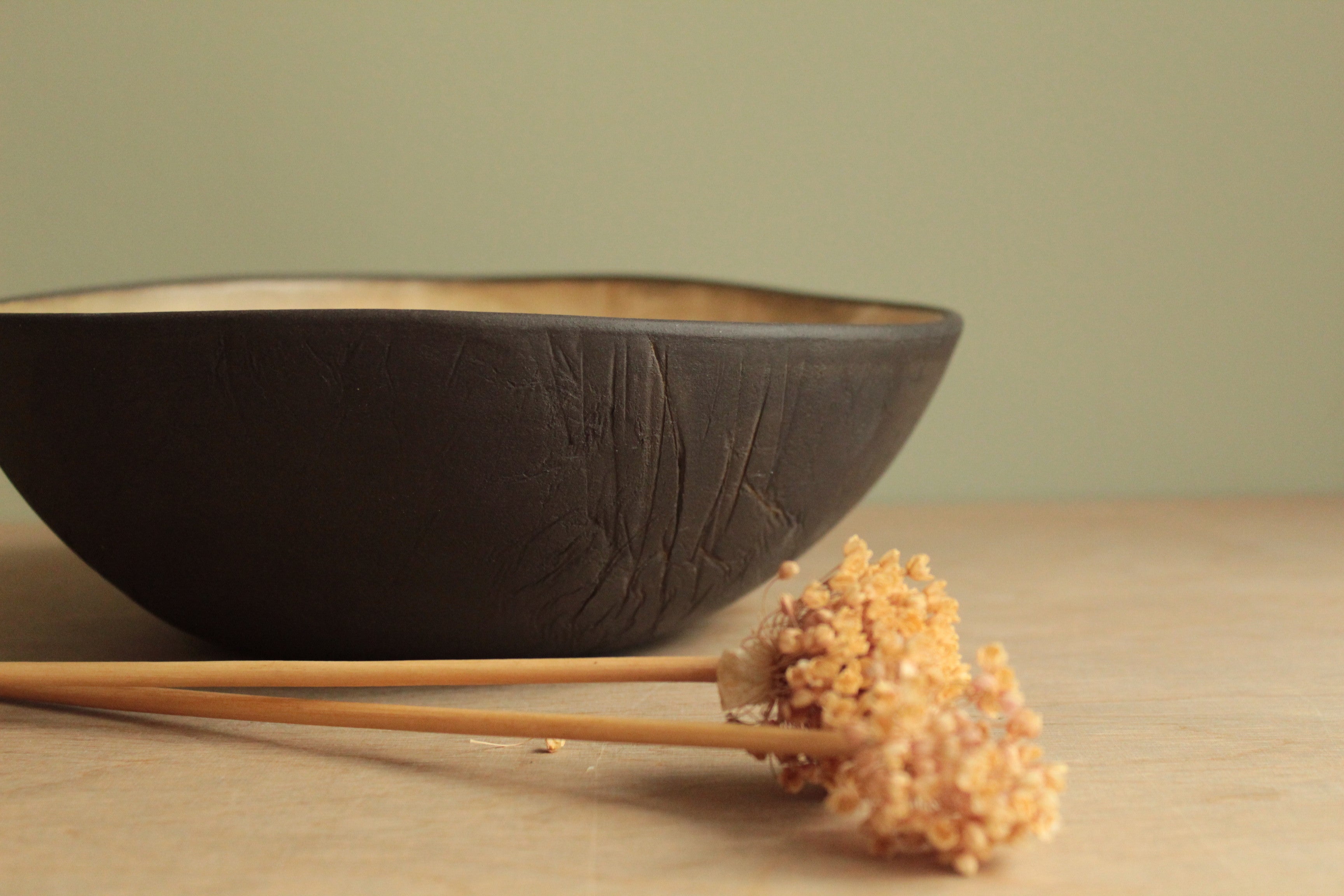 Black/beige serving bowl with texture