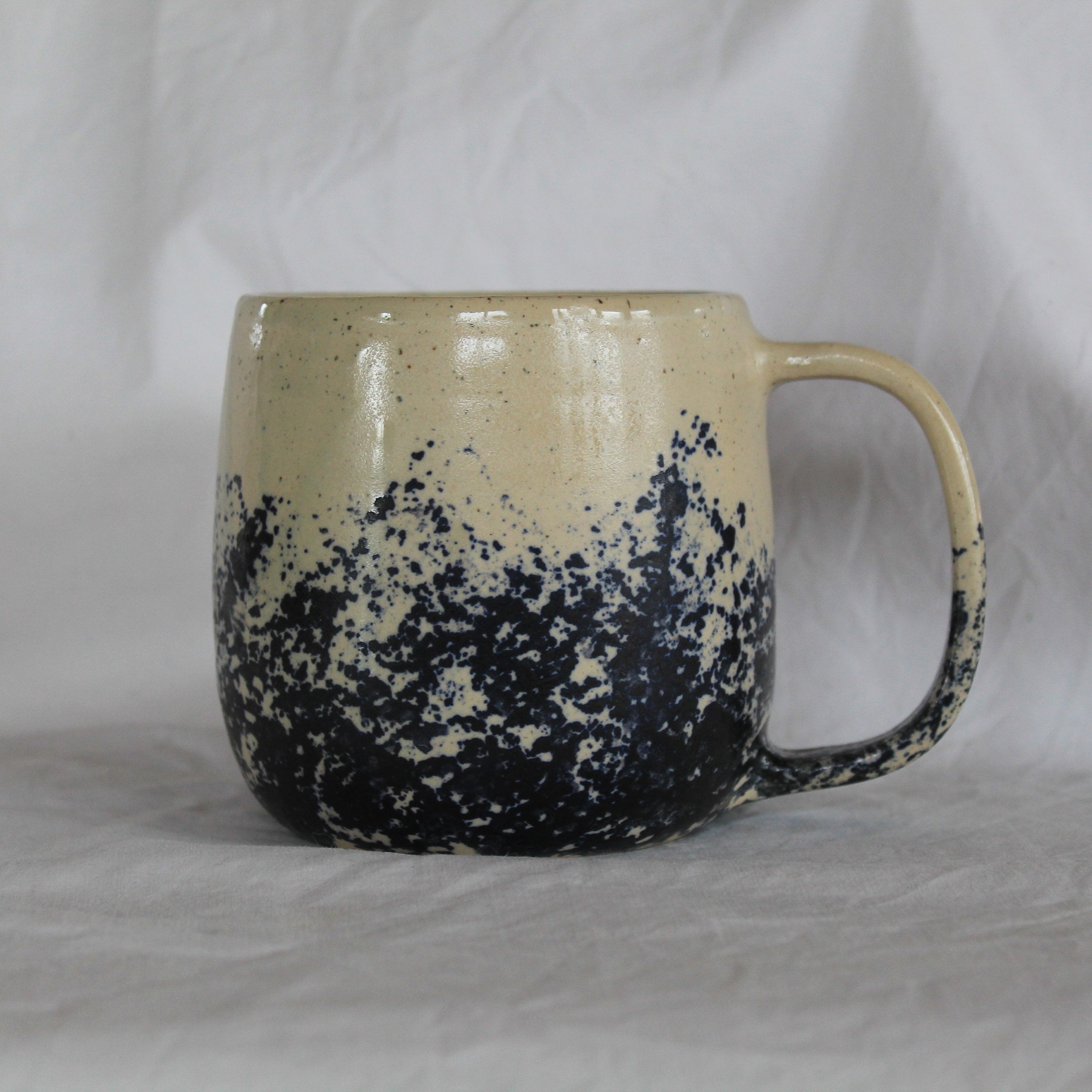 White mug with blue design