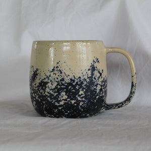 White mug with blue design