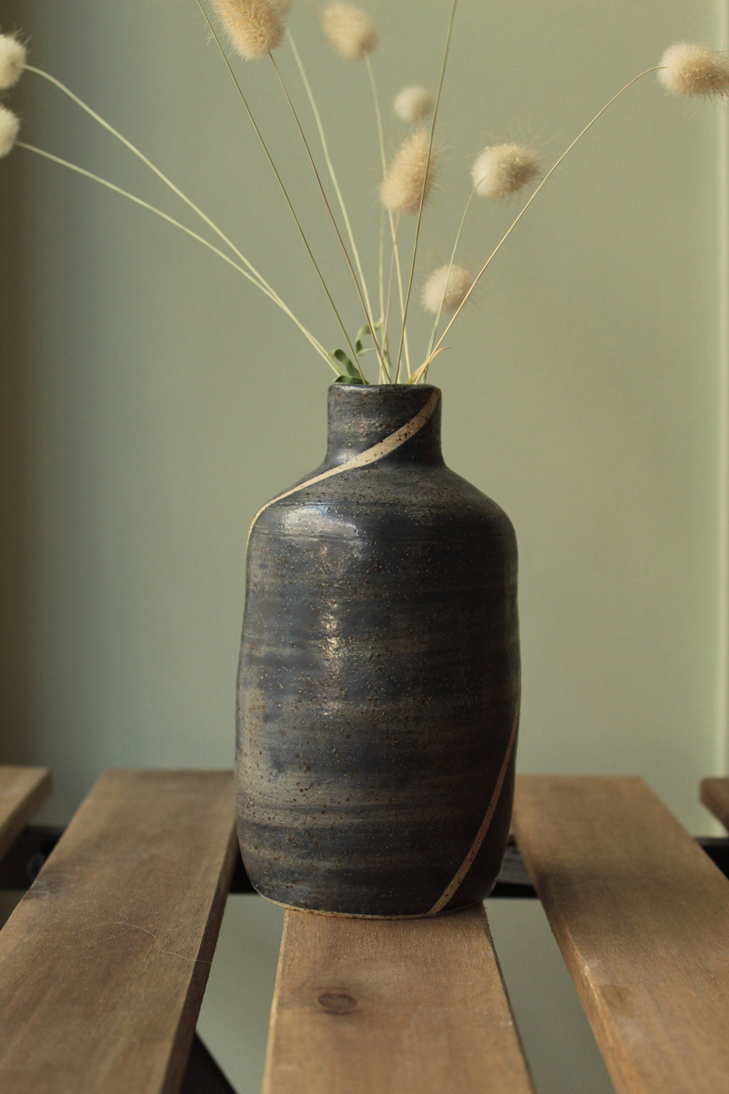 Blue bottle or vase with stripe