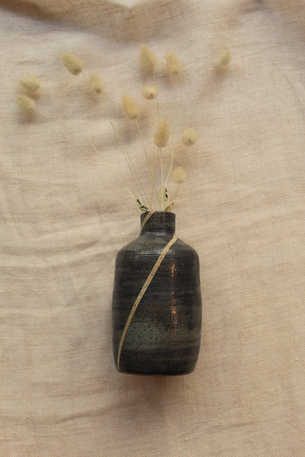 Blue bottle or vase with stripe